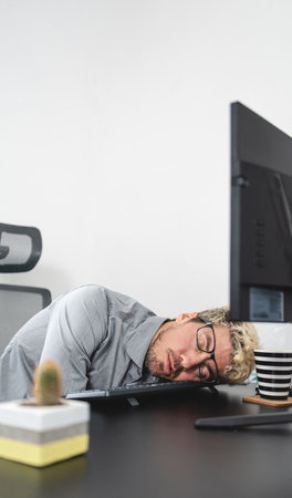 Businessman falling asleep in the office, Stress and overwork concept. portrait photoの写真素材