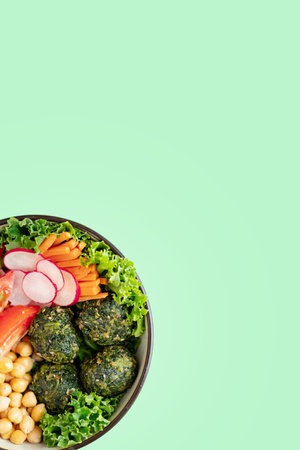 Plant based, vegan bowl of food. Top view. Copyspace. Green Backgroundの写真素材