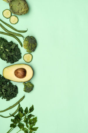Banner of fresh seasonal green vegetables on green background. copy-spaceの写真素材