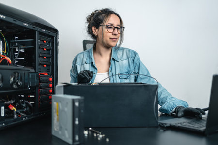 Hispanic young woman doing diagnosis on desktop computer. white backgroundの写真素材
