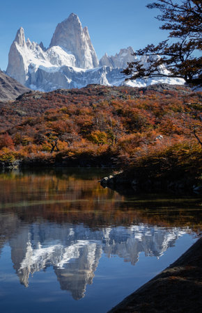 Big rocky peak mountains with snow with the reflection on water. Autumn season in Launa Capri El Chalten, Patagonia, Argentina. portrait photographyの写真素材
