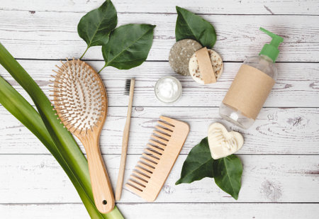 Top view of zero waste bathroom accessories. Hairbrush, comb, toothbrush, shampoo bar, body lotion and organic soap. Eco friendly and sustainability background conceptの写真素材