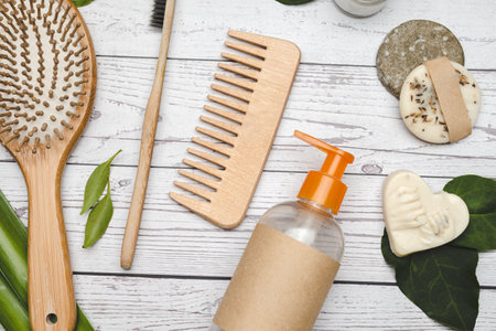 Zero waste and organic bathroom accessories flat lay background composition. Bamboo hair brush, combo and toothbrushの写真素材