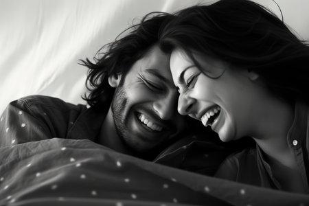 Black and white photography of couple laughing together. Generative AIの素材
