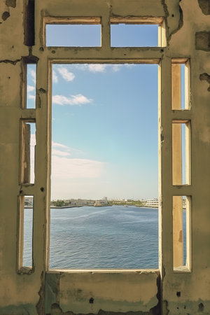 Old vintage window frame with ocean view. Generative AIの素材