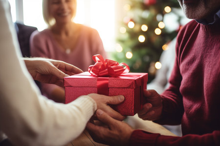 Unrecognizable people exchanging gifts for Christmasの素材