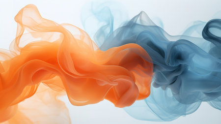 Orange and blue ink flowing over white backgroundの素材