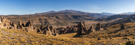 Panoramic view of Los Bolillos, Neuquen, Argentina. Striking, eroded rock formations under a clear sky in Arid landscapeの写真素材