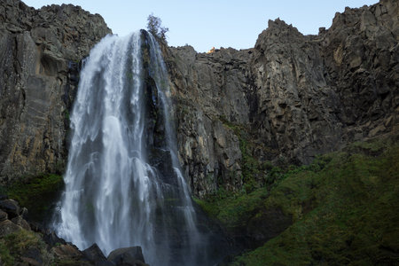 Imposing La Fragua Waterfall: The force of nature in a rocky Patagonian landscape. Manzano Amargo, Neuquen tourist destination, Argentinaの写真素材