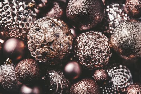 vintage christmas, new Year toys and decoration in basket on brown wooden table with garlands, copy spaceの写真素材
