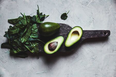 Avocado. Healthy food on the table. Rustic board.