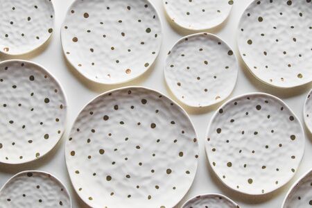Plates and dishes for serving a festive table on white colors background.