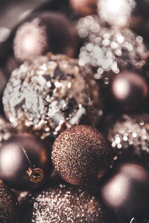 vintage christmas, new Year toys and decoration in basket on brown wooden table with garlands, copy spaceの写真素材