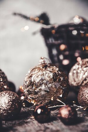 vintage christmas, new Year toys and decoration in basket on brown wooden table, copy spaceの写真素材