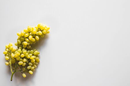 Green grape bunch isolated on white backgroundの写真素材