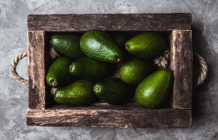 Avocado. Healthy food on the table. Vintage wooden boxの写真素材