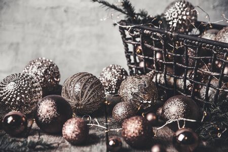 vintage christmas, new Year toys and decoration in basket on brown wooden table, copy spaceの写真素材