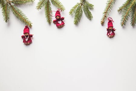 Christmas and New Year, twigs from a Christmas tree with toys on a white background.の写真素材