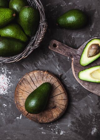 avocado on a cutting board with a kitchen towel in a vintage styleの写真素材