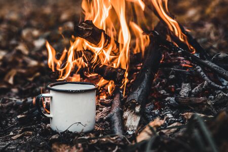 Making coffee at the stake. Make coffee or tea on the fire of nature. Burned fire. A place for fire. Ashes and coal.の写真素材