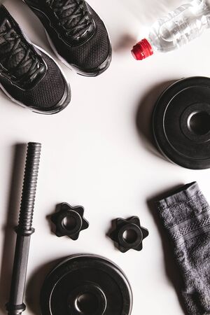 Fitness concept background with sneakers, water bottle. Top view with space for your textの写真素材