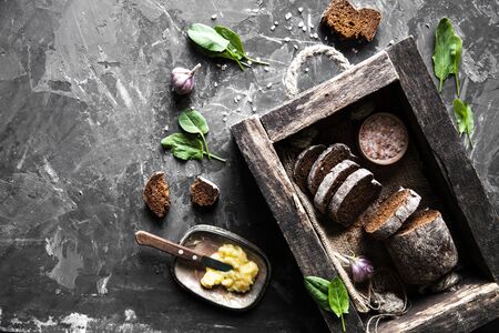 bread in an old wooden box already cut into pieces. foodの写真素材