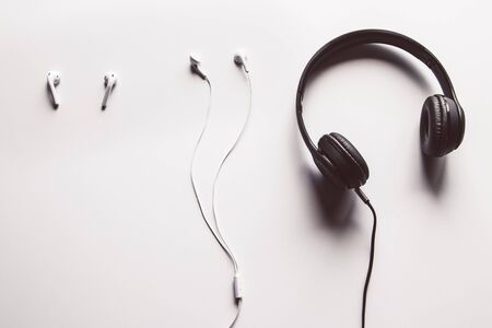 Headphones wireless comparison with wired earphones, copy space.の写真素材