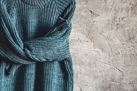 Blue Warm Long Sleeve Shirt on Black Hanger Hang on gray backgroundの写真素材