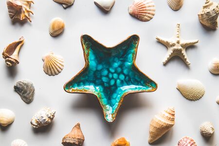 Beautiful table starfish decoration on white background, top view.