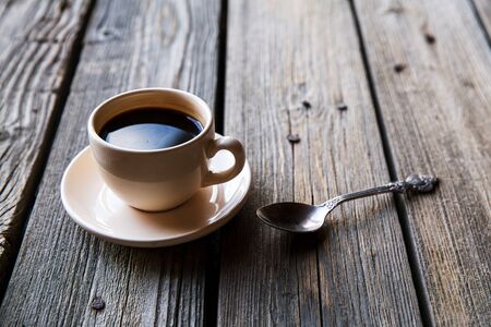 Coffee cup on wooden table background,Top viewの写真素材