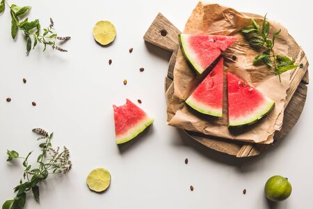 watermelon on a sliced board with mint and slices of lime. foodの写真素材