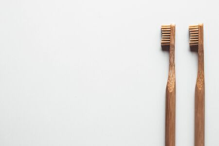 Wooden bamboo toothbrushes on white background isolated. The concept of zero waste, recyclingの写真素材
