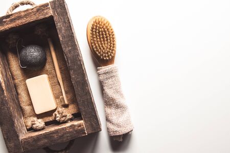 Natural brushes made of wood and soap on the background of concrete, bamboo toothbrushes PNOV2019の写真素材
