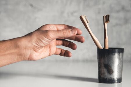 Wooden bamboo toothbrushes on white background isolated. The concept of zero waste, recycling