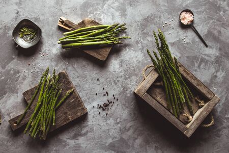 Asparagus on a cutting board. Healthy food, health on a concrete background.の写真素材
