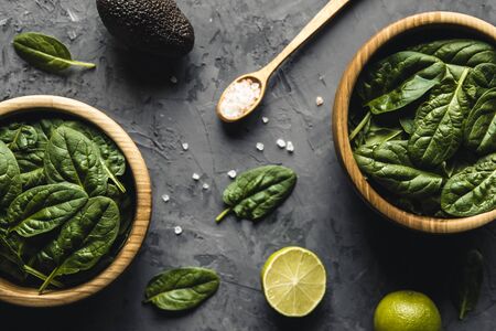 Green food background on stone table top view. Healthy food, vegan, eco products.