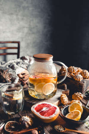 Hot tea with slices of fresh grapefruit on wooden background. Healthy drink, Eco, veganの写真素材
