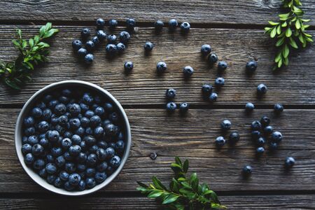 Bowl of blueberries on a wooden background. Healthy food, healthの写真素材