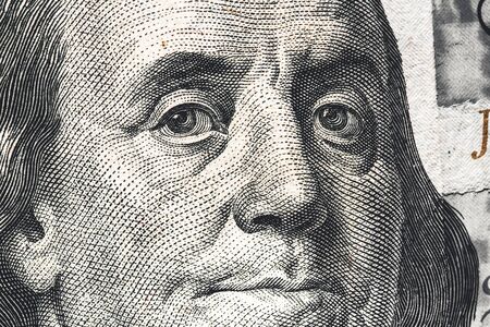 Close-up of one hundred bill Franklin portrait