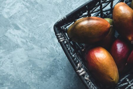 Basket of Big Mangoes in Africaの写真素材