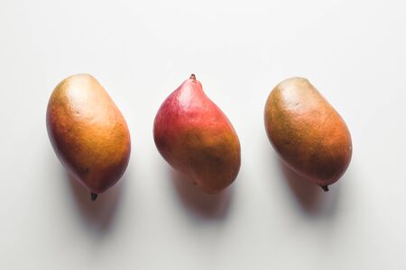 Group of mangos on white background. Healthy food, healthy lifestyle.