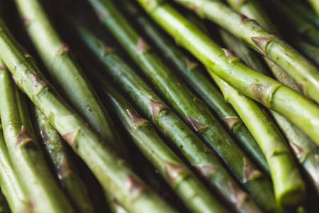 Fresh green spring asparagus on a wooden background. Asparagus seasonの写真素材