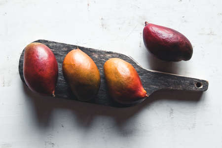 Ripe Mango on a cutting boardの写真素材