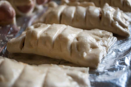 cooking baking confectionery oven puffs dough sausage in dough background