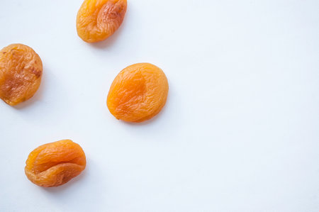 dried apricots orange dried apricot on a white backgroundの写真素材