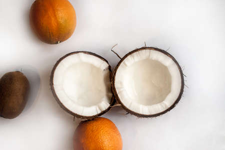 summer background from coconut, orange on pink background