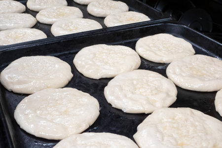 Raw cakes before baking on baking sheetの写真素材