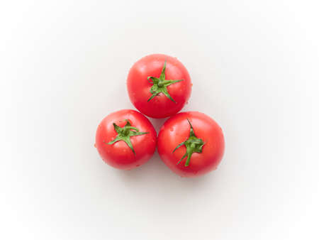 Three red tomatoes. Top viewの写真素材