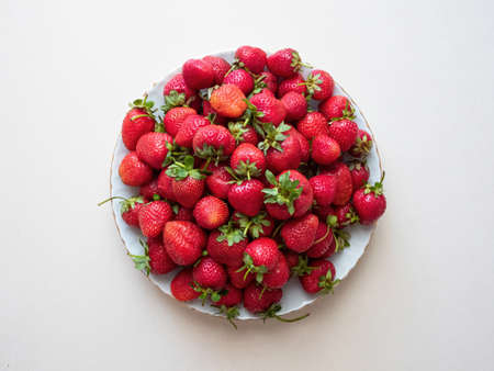 Red strawberries on a plateの写真素材
