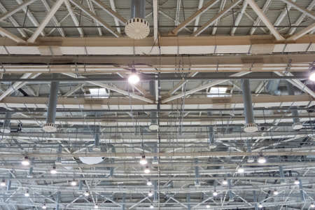 Pavilion ceiling with lights on, inside the buildingの写真素材